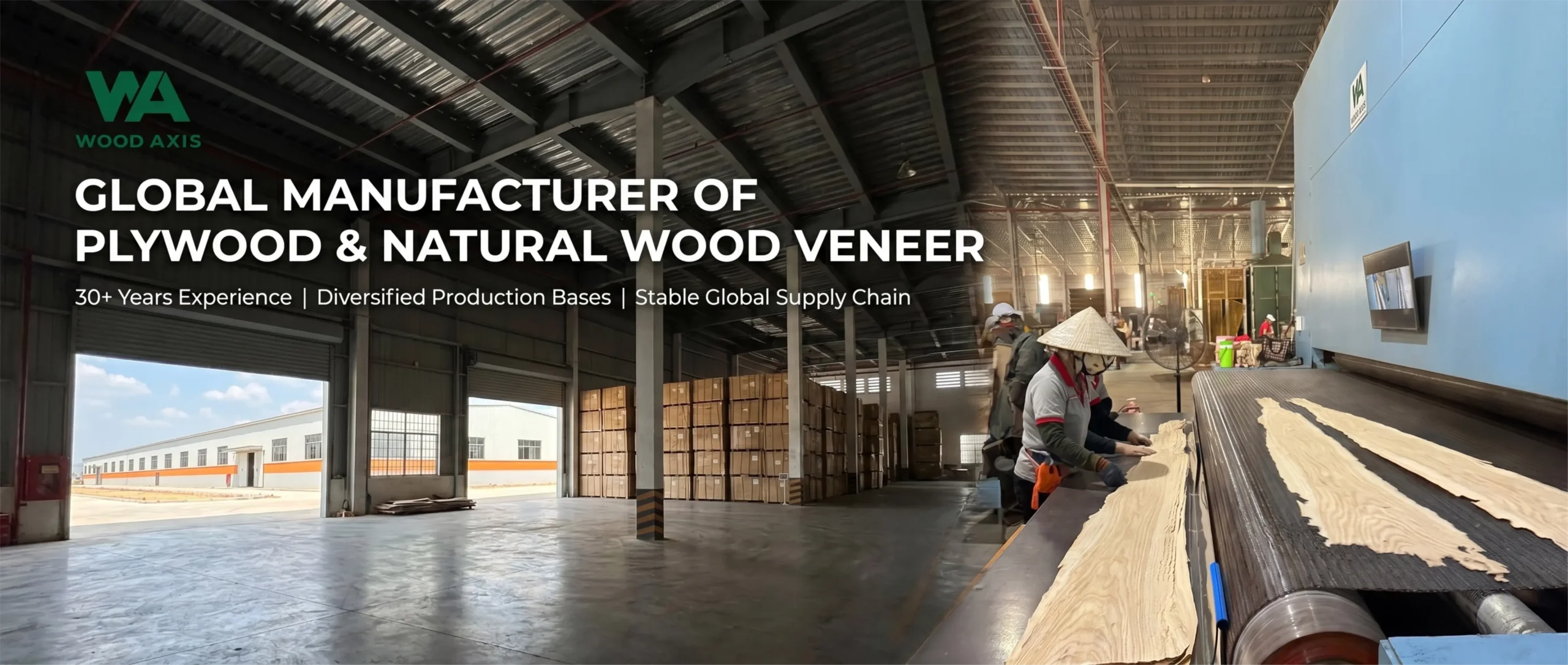 Large-scale finished goods warehouse with extensive inventory of plywood ready for export and veneer production.
