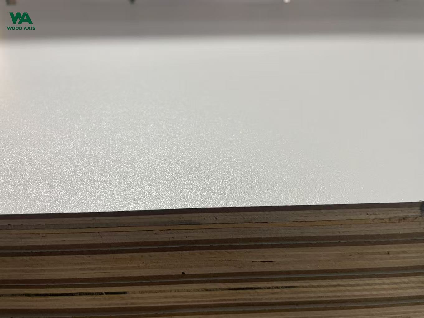 Edge cross section of 18mm melamine plywood showing solid core layers with no gaps