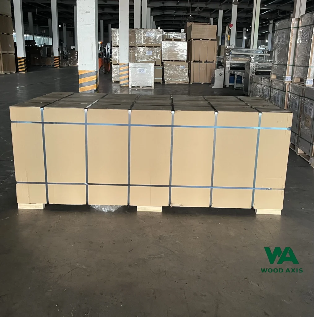 WoodAxis Plywood Manufacturing Process: From Raw Logs to Finished Boards 8 Finished plywood panels securely on wooden pallets for safe international shipping.