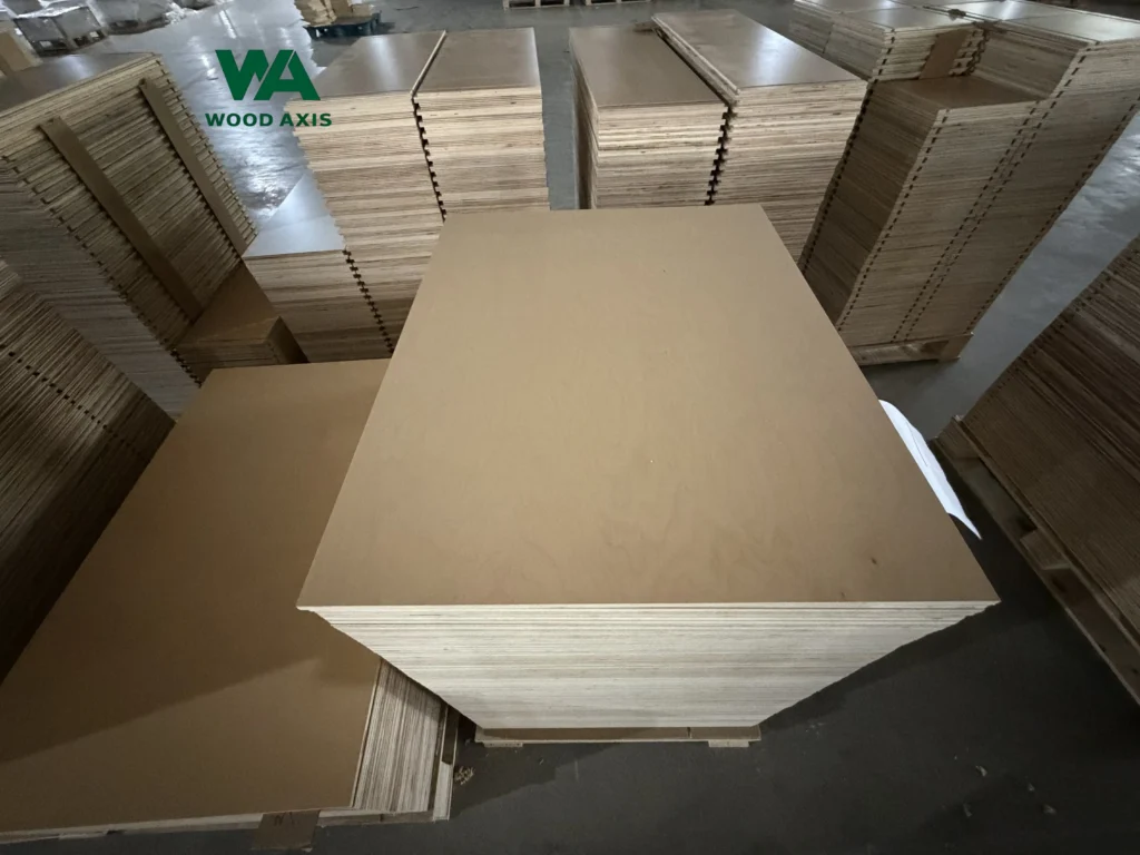 E0, E1 vs. CARB P2 Plywood Standards: Differences and Selection Guide 7 Neatly stacked wooden plywood sheets stored in a warehouse for export