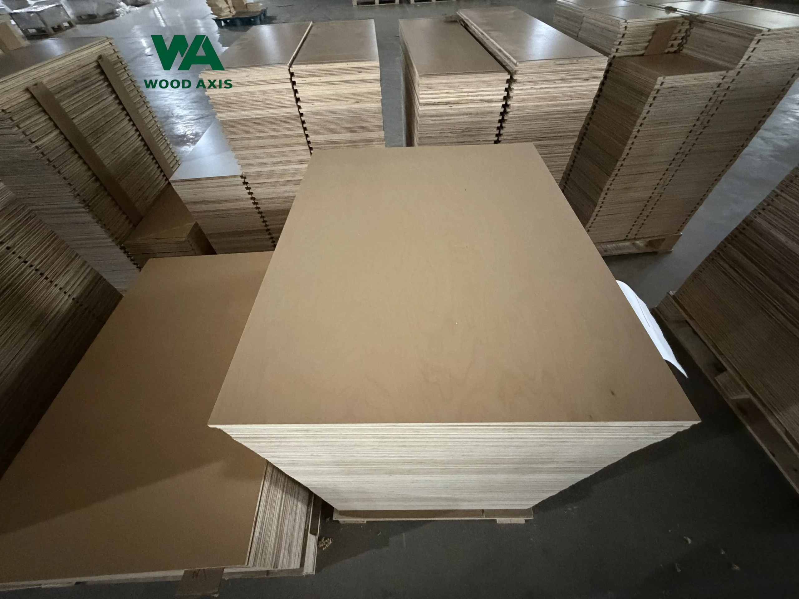 Blog 7 Neatly stacked wooden plywood sheets stored in a warehouse for export