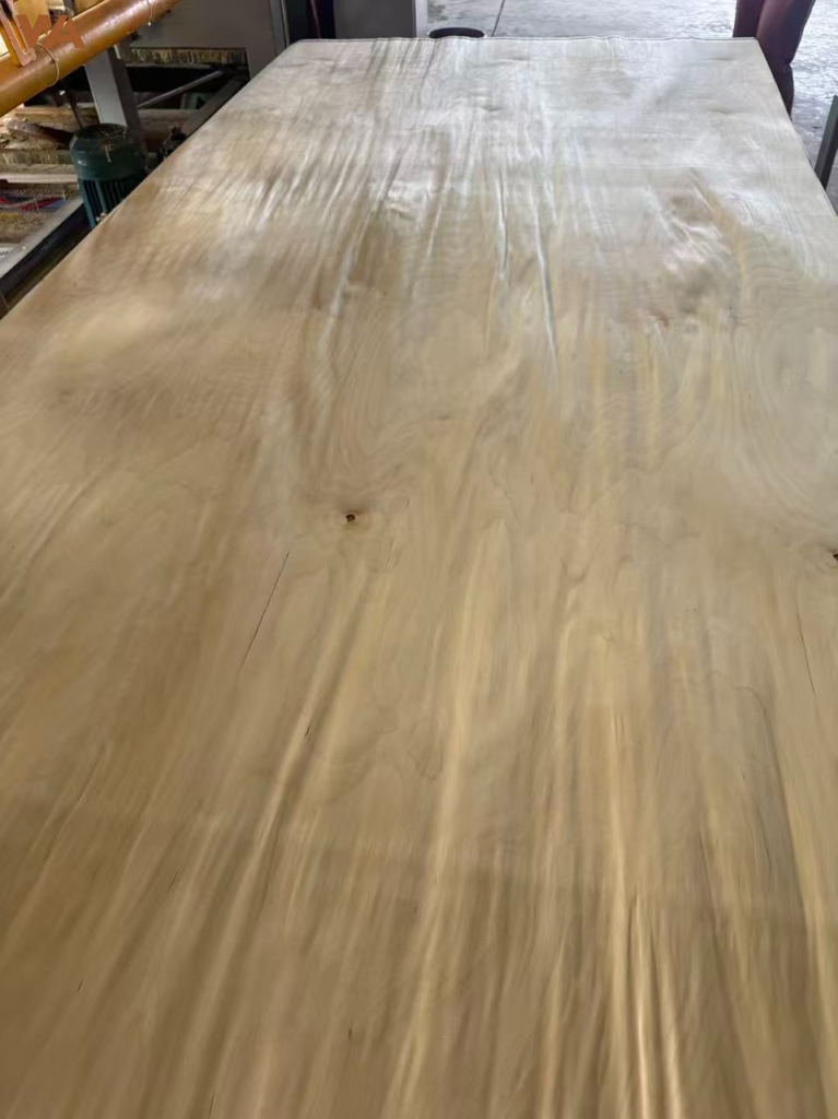 Natural birch veneer sheet with detailed grain pattern for furniture surfacing.